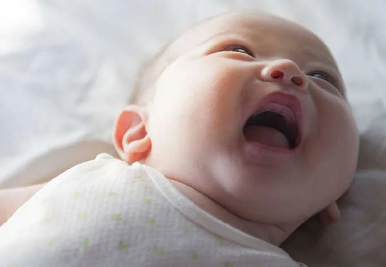 smiling newborn baby