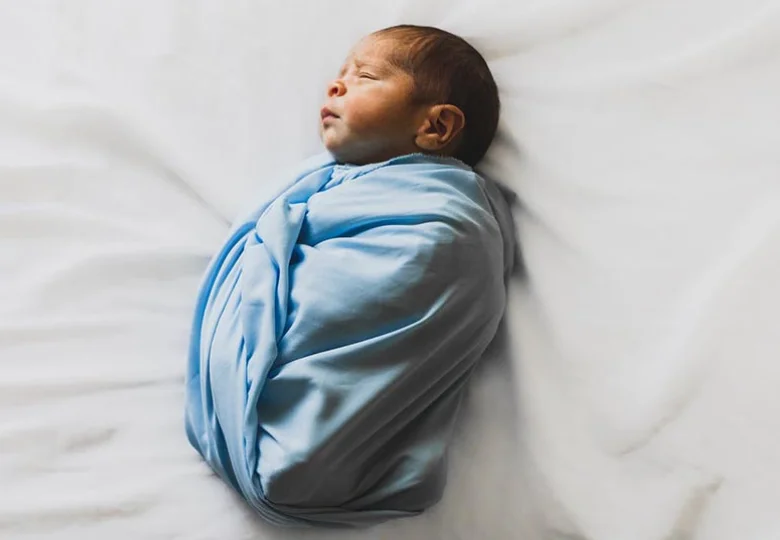 wrapped newborn baby photo
