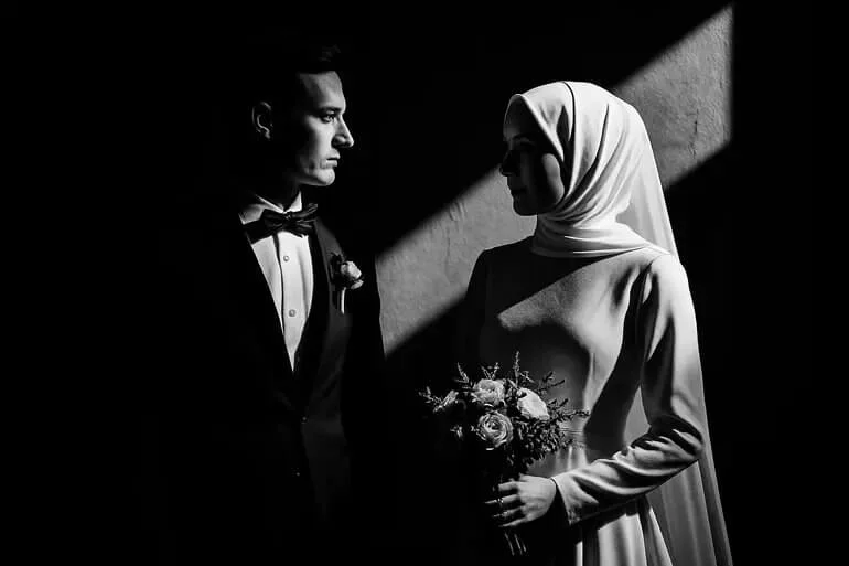Wedding photo with bold blacks, bright whites, and dramatic contrast.