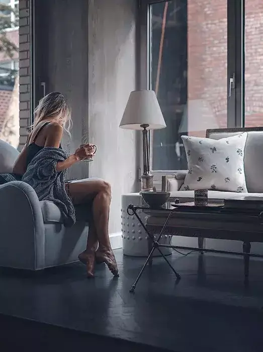 girl relaxing at home on armchair female pose