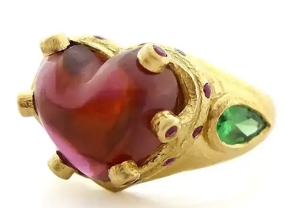 an awkward ring with heart and eyes