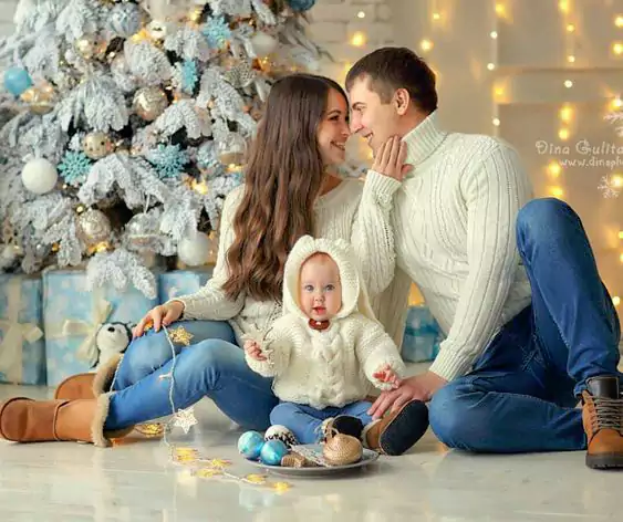 Everyone In The Family Is Dressed In White Sweaters