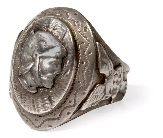 ugly ring with ancient sculpture