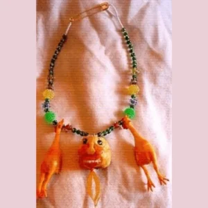 featherless chicken with necklace