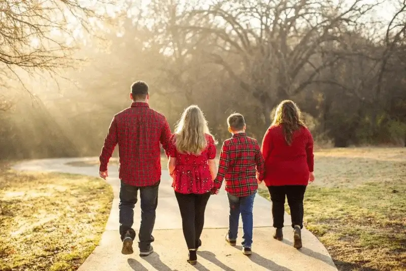 Siblings Holding Hands or Embracing