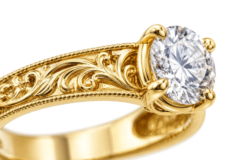 Close-up of fine jewelry engraving and gemstone detail on a clean background